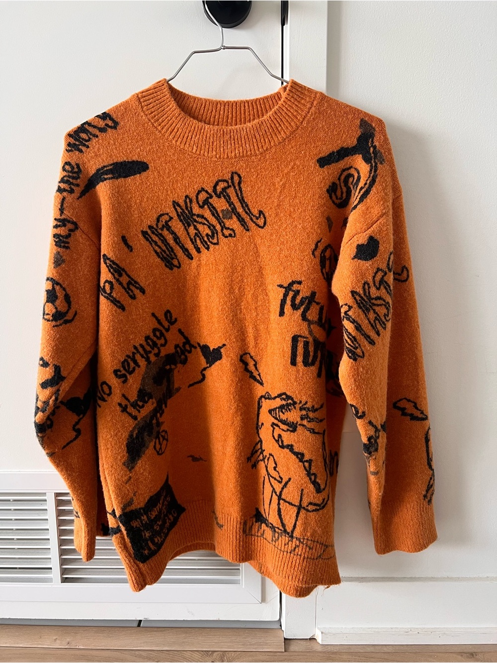 Vintage Orange Crewneck Sweater with Black Graphic Print